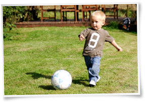 Toddler kicking ball