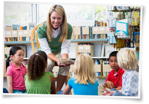 Preschool children watching a demonstration by their teacher in a classroom